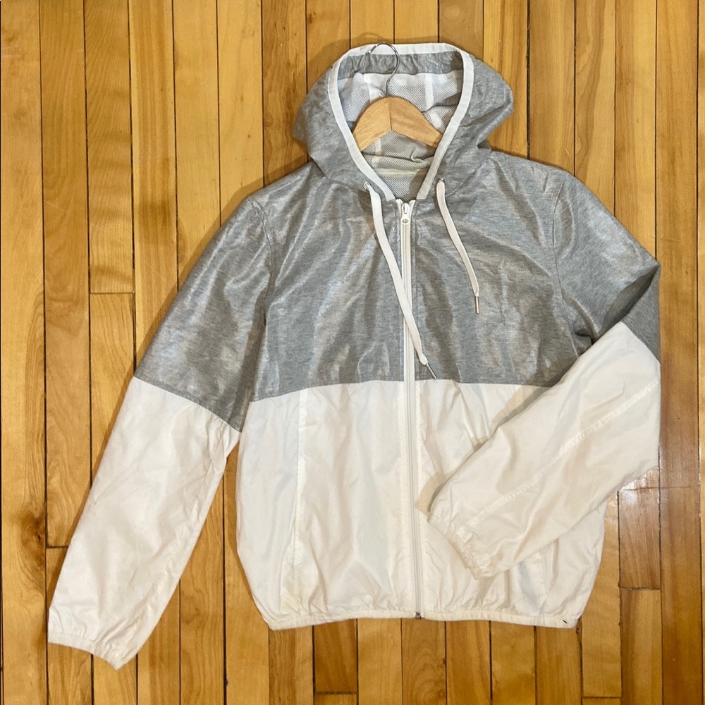 White and grey hooded rain coat / wind breaker
